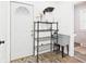 Functional mud room with a utility sink, shelving, and access to the exterior at 1910 W 10Th St, Anderson, IN 46016