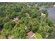 Aerial view of lakefront homes surrounded by lush greenery at 1927 E Derby Ct, Martinsville, IN 46151