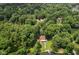 Scenic aerial view of a home nestled amongst trees with lake access at 1927 E Derby Ct, Martinsville, IN 46151