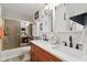 Stylish bathroom with a double vanity, white shiplap walls, and decorative mirrors at 1927 E Derby Ct, Martinsville, IN 46151