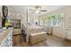 Charming bedroom with a four-poster bed, hardwood floors, and an abundance of natural light at 1927 E Derby Ct, Martinsville, IN 46151