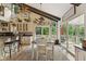 Well-lit dining area next to kitchen with stylish decor and a view of the outdoor deck through glass doors at 1927 E Derby Ct, Martinsville, IN 46151