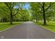 Long tree lined driveway leading to a private residence at 1927 E Derby Ct, Martinsville, IN 46151