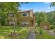 Attractive home showcasing a well-kept yard, stone accents, and a quaint walkway to the entrance at 1927 E Derby Ct, Martinsville, IN 46151