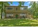 Charming home featuring a stone facade, large windows, well-maintained lawn, and mature trees at 1927 E Derby Ct, Martinsville, IN 46151