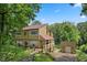 Beautiful two-story home with stone accents, covered porch, and waterfront access to the lake at 1927 E Derby Ct, Martinsville, IN 46151