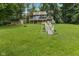 Two-story home featuring a large yard, multi-level deck, and stairs leading to the house at 1927 E Derby Ct, Martinsville, IN 46151