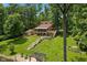 Beautiful outdoor view of a multi-level home with long staircases and waterfront access at 1927 E Derby Ct, Martinsville, IN 46151