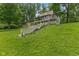 Beautiful multi-level home with an expansive lawn and staircase leading to a private backyard oasis at 1927 E Derby Ct, Martinsville, IN 46151