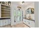 Inviting foyer featuring a decorative front door with sidelights, built-in shelving, and stylish accents at 1927 E Derby Ct, Martinsville, IN 46151