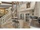 Stylish kitchen with bar seating, modern appliances, and a view of the staircase and adjacent spaces at 1927 E Derby Ct, Martinsville, IN 46151