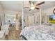 Bright bedroom features a beautiful four-poster bed, mirrors, and sliding door closet at 1927 E Derby Ct, Martinsville, IN 46151