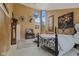 Spacious main bedroom with high ceilings, carpet, fireplace, decor, and a large window at 1927 E Derby Ct, Martinsville, IN 46151