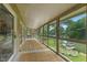 Enclosed porch offering panoramic views of the lake, creating a serene and relaxing atmosphere at 1927 E Derby Ct, Martinsville, IN 46151