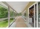 Relaxing sunroom with abundant natural light, large windows, and sliding doors to the outside at 1927 E Derby Ct, Martinsville, IN 46151