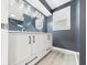 Modern bathroom with dual vanity, round mirrors, and sleek black hardware at 2126 Tartan Rd, Anderson, IN 46012