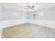 Spacious bedroom with wood-look floors, a ceiling fan, and a window at 2126 Tartan Rd, Anderson, IN 46012