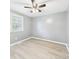 Light filled bedroom with ceiling fan, wood-look floors, and natural light at 2126 Tartan Rd, Anderson, IN 46012