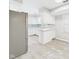 Open-concept kitchen with stainless steel appliances and white cabinets at 2126 Tartan Rd, Anderson, IN 46012