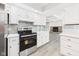 Kitchen with stainless steel oven and white cabinets at 2126 Tartan Rd, Anderson, IN 46012