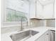 Kitchen sink with a view. White cabinets and countertops at 2126 Tartan Rd, Anderson, IN 46012