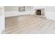 Spacious living room with light wood floors, stone fireplace, and natural light at 2126 Tartan Rd, Anderson, IN 46012