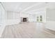 Bright living room featuring a stone fireplace, ceiling beams, and a walk-out patio at 2126 Tartan Rd, Anderson, IN 46012