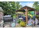 Backyard patio with gazebo, adorned with flowers and foliage, creating a serene retreat at 2608 E 500 N, Whiteland, IN 46184