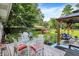 Backyard with patio seating and a gazebo, perfect for entertaining or enjoying the outdoors at 2608 E 500 N, Whiteland, IN 46184
