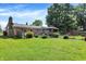 Sprawling backyard featuring a charming gazebo, firepit area, and lush greenery at 2608 E 500 N, Whiteland, IN 46184