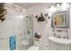 Bathroom features a tiled shower, vanity, decorated shelves, commode, and other decor at 2608 E 500 N, Whiteland, IN 46184