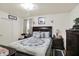 Well-lit bedroom features plush bedding, stylish lamps, and classic decor for ultimate relaxation at 2608 E 500 N, Whiteland, IN 46184