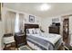 Cozy bedroom with plush bedding, stylish lamps, and classic decor for ultimate relaxation at 2608 E 500 N, Whiteland, IN 46184