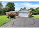 Beautiful brick home featuring an attached garage, a covered front porch and a well-kept lawn at 2608 E 500 N, Whiteland, IN 46184