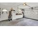 Well-lit garage interior with storage cabinets, work area and garage door with decorative windows at 2608 E 500 N, Whiteland, IN 46184