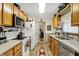 Functional kitchen featuring wooden cabinets, laminate countertops, and essential appliances, ready for cooking at 2608 E 500 N, Whiteland, IN 46184