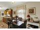 Eat-in kitchen with kitchen view; table, chairs, flowers, curtains and lighting at 2608 E 500 N, Whiteland, IN 46184