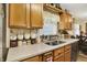 This kitchen features wooden cabinets, stainless steel sinks, and light-colored countertops at 2608 E 500 N, Whiteland, IN 46184