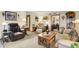 Warm living room with a comfortable leather armchair, a cozy sofa, and inviting decor at 2608 E 500 N, Whiteland, IN 46184