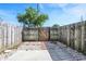 Backyard with a mix of concrete, stones and a wooden fence, creating a private outdoor space at 2642 Country Estates Dr, Indianapolis, IN 46227