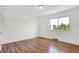 Bright bedroom with a large window and hardwood floors at 2642 Country Estates Dr, Indianapolis, IN 46227