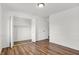 Bedroom featuring a large closet with wood-look flooring and a neutral color palette at 2642 Country Estates Dr, Indianapolis, IN 46227