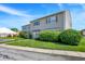 Exterior shot showcasing townhome, landscaping, and exterior facade at 2642 Country Estates Dr, Indianapolis, IN 46227