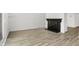 Bright living room with modern floors and a cozy black fireplace at 2642 Country Estates Dr, Indianapolis, IN 46227