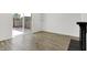 Bright living room with hardwood floors and access to a private patio at 2642 Country Estates Dr, Indianapolis, IN 46227