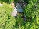 Aerial shot of a home with lush greenery and mature trees surrounding the property at 3312 W 42Nd St, Indianapolis, IN 46228