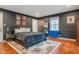 Bedroom with decorative rug, queen bed, and light-filled window at 3312 W 42Nd St, Indianapolis, IN 46228