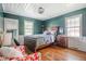 Cozy bedroom with bead board ceiling and trim, plus hardwood floors at 3312 W 42Nd St, Indianapolis, IN 46228
