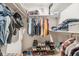 Walk-in closet with shelving, hanging clothes and plenty of storage space at 3312 W 42Nd St, Indianapolis, IN 46228