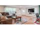 Inviting living room featuring hardwood floors, and ample natural light at 3312 W 42Nd St, Indianapolis, IN 46228